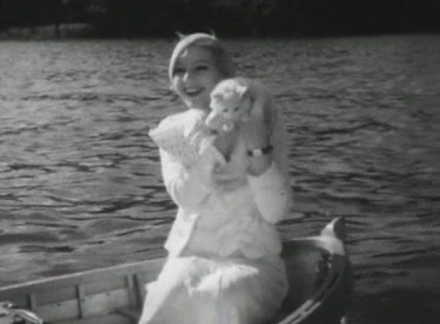 En stilla flirt - Diddi Tutta Rolf holding white cat Murre in launch