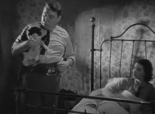 St. Martin's Lane - Charles picks up black and white cat from bed