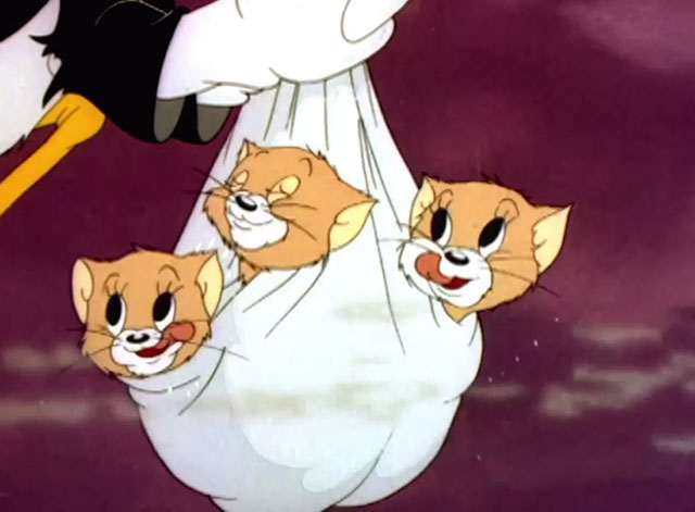 The Stork's Holiday - three cartoon kittens in bundle licking lips