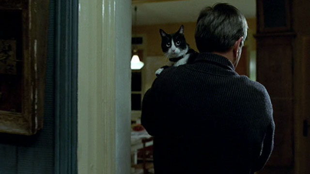 Histoire de Marie et Julien - The Story of Marie and Julien - Jerzy Radziwilowicz with tuxedo cat Nevermore Gaspard over shoulder