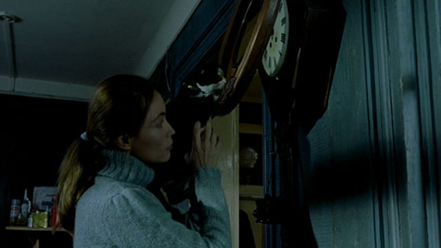 Histoire de Marie et Julien - The Story of Marie and Julien - Emmanuelle Béart with tuxedo cat Nevermore Gaspard opening clock