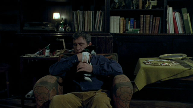 Histoire de Marie et Julien - The Story of Marie and Julien - Jerzy Radziwilowicz cuddling with tuxedo cat Nevermore Gaspard