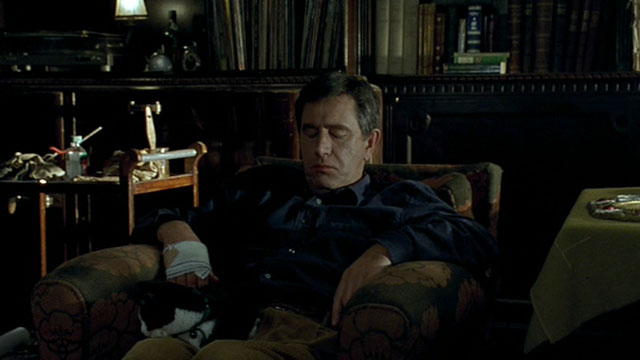 Histoire de Marie et Julien - The Story of Marie and Julien - Jerzy Radziwilowicz with tuxedo cat Nevermore Gaspard on lap