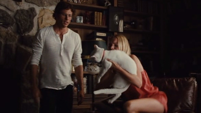 Straw Dogs 2011 - white cat Flutie held up by Amy Kate Bosworth toward David James Marsden