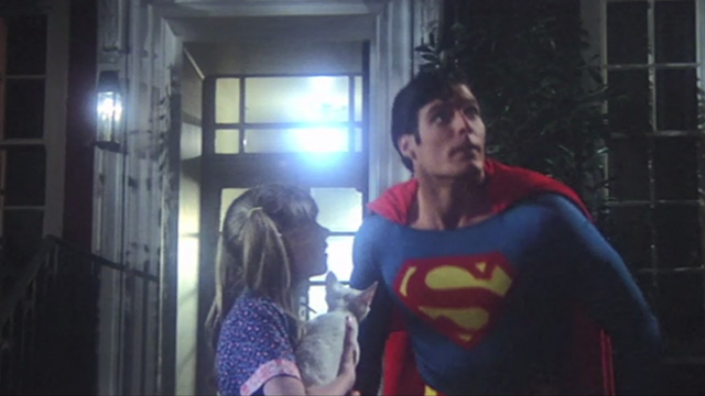 Superman - Superman Christopher Reeve preparing to fly away from little girl Jayne Tottman and white cat Frisky