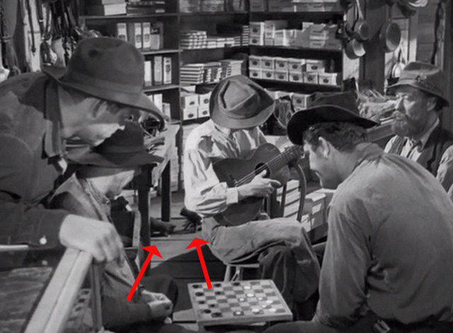 Swamp Water - kittens in background on floor of general store