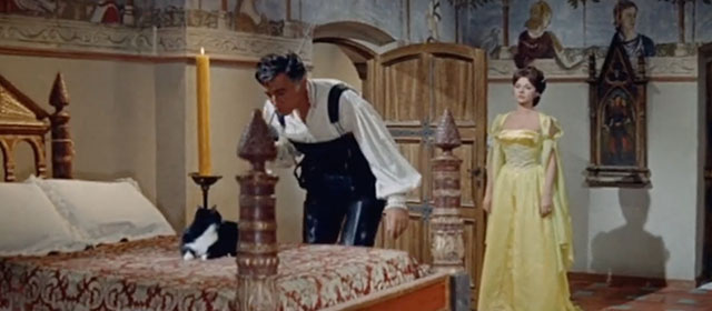 Swordsman of Siena - Stanswood Stewart Granger approaching bed with tuxedo cat on top with Orietta Sylva Koscina behind