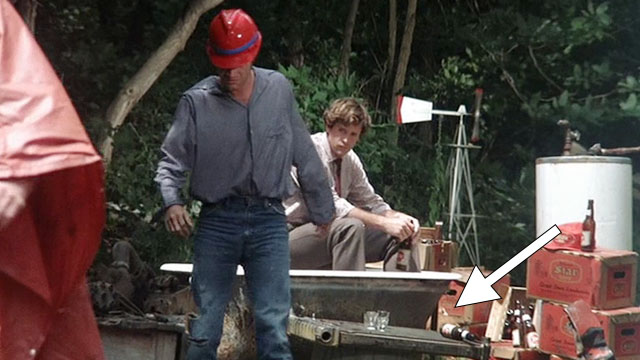 Take This Job and Shove It - Frank Robert Hays watching Harry David Keith walk away while ginger and white tabby cat stands nearby