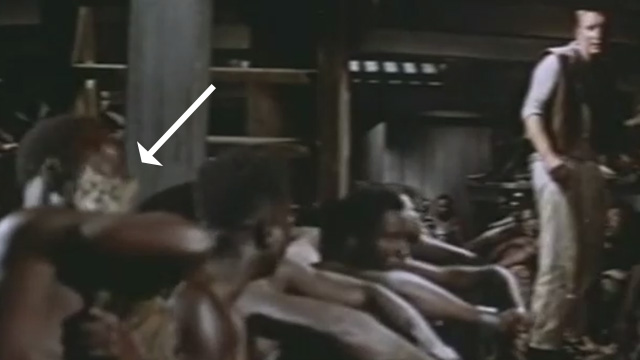 Tamango - tabby cat held by slave in hold