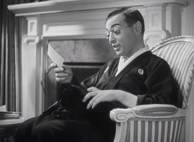 Thank You, Mr. Moto - Mr. Moto Peter Lorre reading invitation in chair with black cat Chunkina