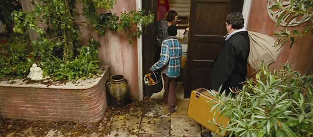 The Thief Lord - Mosca Lathaniel Dyer carrying bucket containing calico kitten and ginger tabby kitten into house