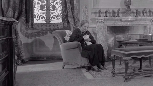 The Third Eye - Il Terzo Occhio - mother Olga Solbelli sitting in chair holding white kitten
