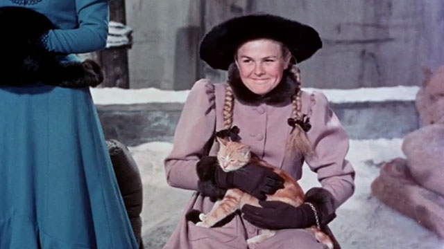 Those Redheads from Seattle - Nell Kay Strother smiling while holding ginger tabby cat President McKinley on lap