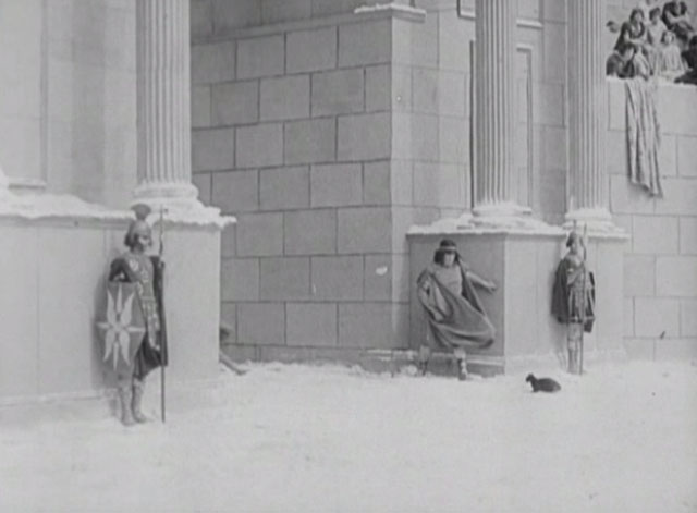 Three Ages - Roman thug throws black cat into arena