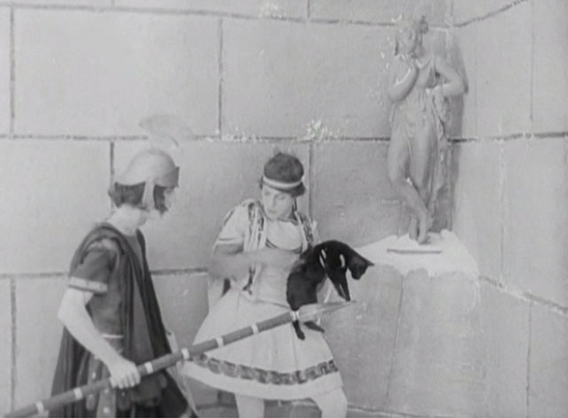 Three Ages - Buster Keaton holding black cat