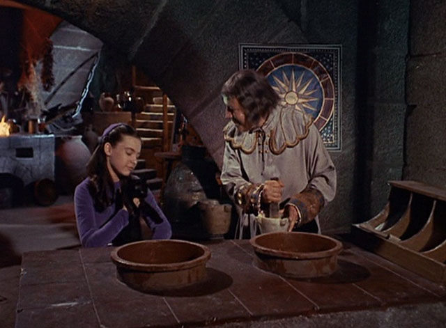 The Three Worlds of Gulliver - Shrike Waveney Lee holding black cat with Makovan Charles Lloyd Pack