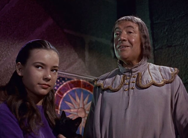 The Three Worlds of Gulliver - Shrike Waveney Lee holding black cat with Makovan Charles Lloyd Pack