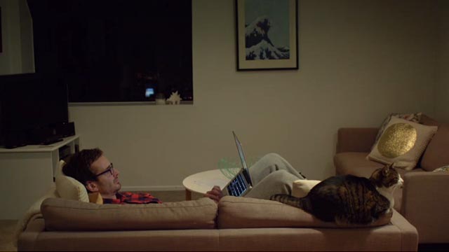 Tickled - David Farrier and cat Minnie on couch