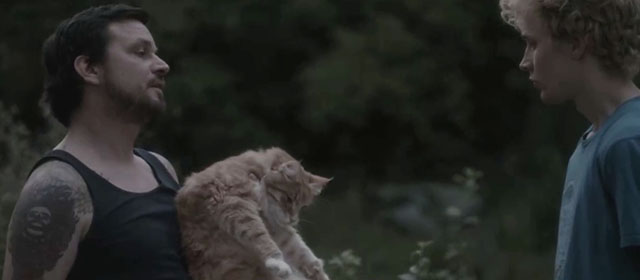 Tore tanzt - Nothing Bad Can Happen - Benno Sascha Alexander Gersak holding longhair ginger tabby cat with Julius Feldmeier