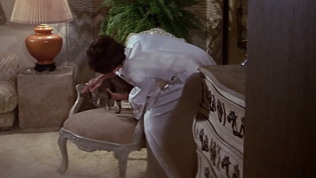 The Towering Inferno - Lisolette Jennifer Jones setting tabby cat Elke on chair