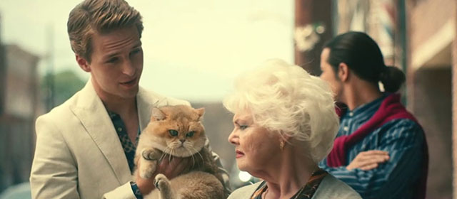 The Toxic Avenger - Daisy Annette Badland with Spence Abraham Lewis holding golden British shorthair cat Mr. Treats