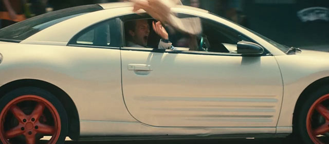 The Toxic Avenger - Spence Abraham Lewis throwing fake golden British shorthair cat Mr. Treats out window of car