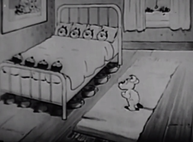Toyland - little dog trying to wake up bed full of black kittens