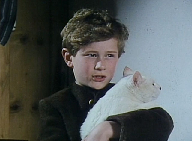 Treasures of the Snow - Dani Timothy Fleetwood holding huge white and calico cat Klaus