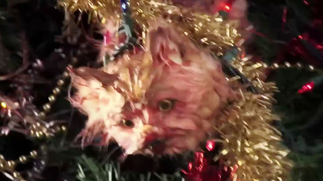 Treevenge - fake cat dead in Christmas tree