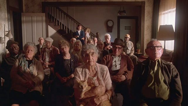 Twilight Zone: The Movie - elderly people in nursing home including Mrs. Dempsey Helen Shaw and orange tabby cat