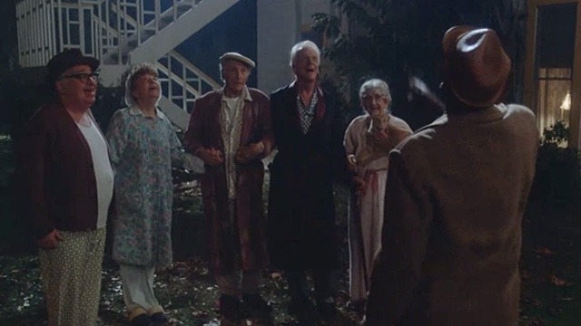 Twilight Zone: The Movie - elderly people outside nursing home including Mrs. Dempsey Helen Shaw and orange tabby cat
