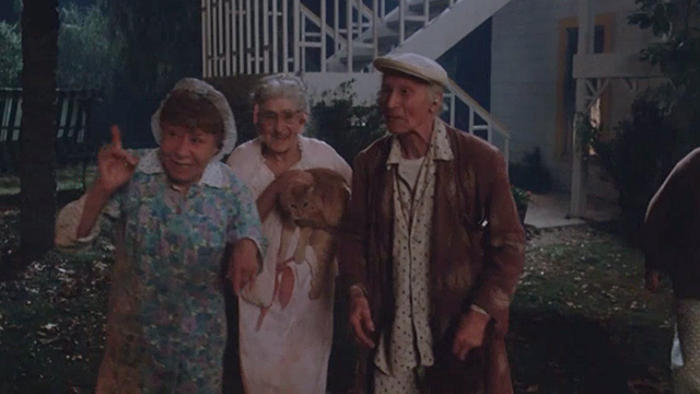 Twilight Zone: The Movie - elderly people and Mrs. Dempsey Helen Shaw and orange tabby cat playing