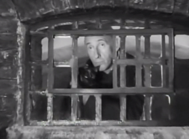 Two Way Stretch - Soapy Wilfrid Hyde-White petting tortoiseshell cat Strangeways behind prison bars