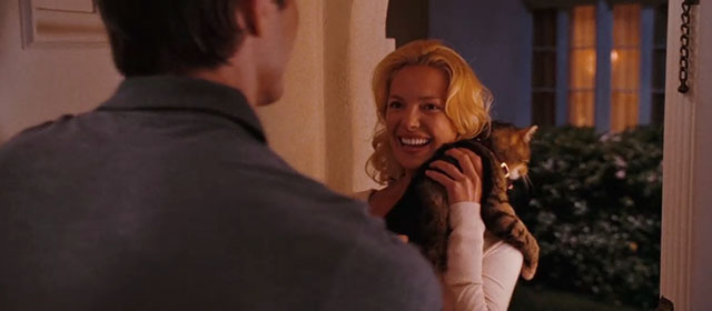 The Ugly Truth - Colin handing brown tabby cat D'Artagnan to Abby Katherine Heigl in doorway