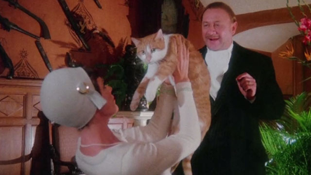 The Uncanny - ginger and white tabby cat Scat being held up by Edina Samantha Eggar with Valentine Donald Pleasance