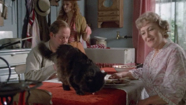 Under Milk Wood - Mrs. and Mrs. Beynon Mary Jones and Hubert Reed with Lily Meg Wynn Owen and longhair black cat on table