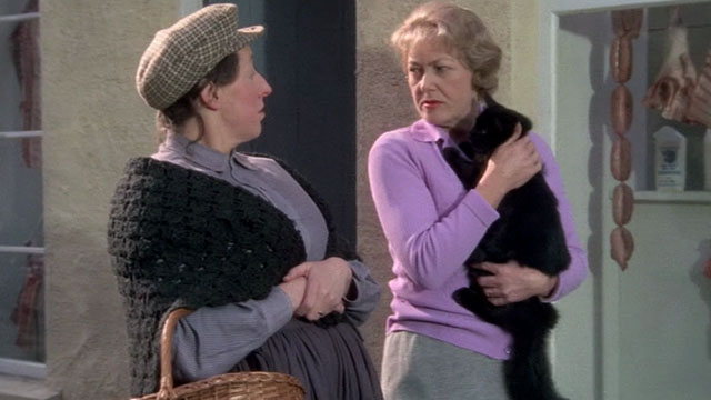 Under Milk Wood - Mrs.  Beynon holding longhair black cat with Mrs. Dai Bread One Dorothea Phillips