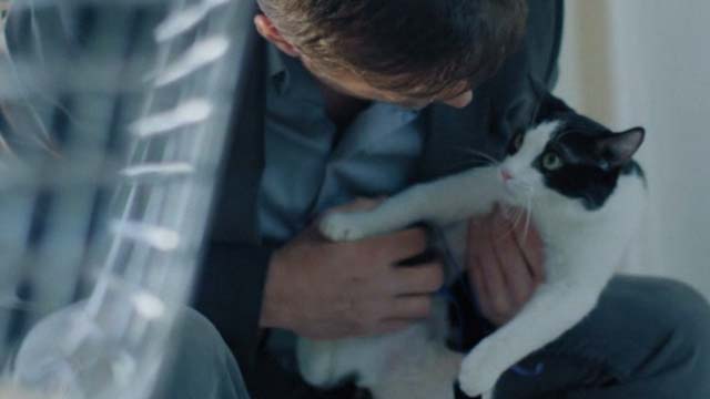 Unknown Caller - Colin David Chisum holding tuxedo cat Mr. Snuggles Oreo