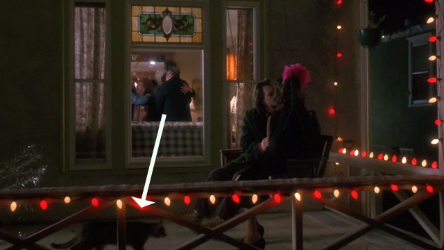 Untamed Heart - Caroline Marisa Tomei kissing Adam Christian Slater as tabby cat walks by on porch