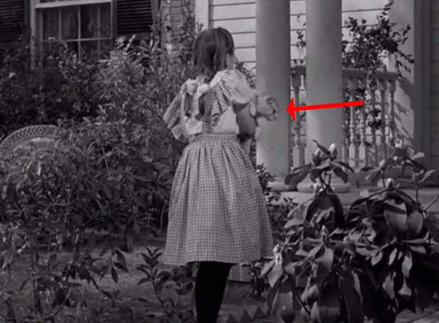 The Vanishing Virginian - Caroline Juanita Quigley still holding white cat Tabitha and newspaper