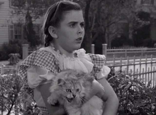 The Vanishing Virginian - Caroline Juanita Quigley holding hissing white cat Tabitha