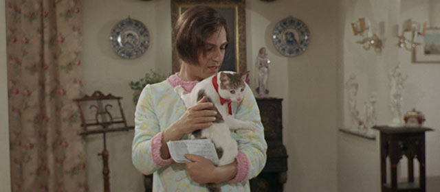 Vedo nudo - I See Naked - Ornella Nino Manfredi holding tabby and white cat Fabiola with red ribbon