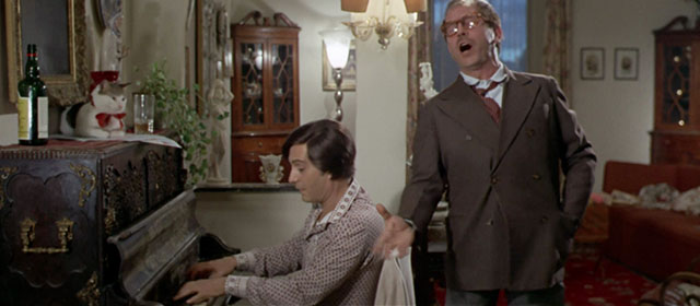 Vedo nudo - I See Naked - Ornella Nino Manfredi and Carlos sharing song with tabby and white cat Fabiola wearing red ribbon on top of piano