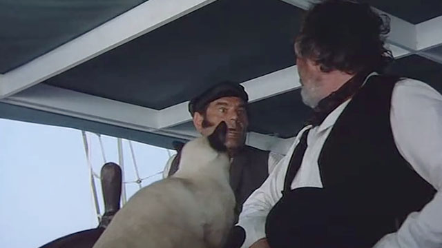 Warlords of Atlantis - Captain Daniels Shane Rimmer and Grogan Hal Galili with Siamese cat on boat