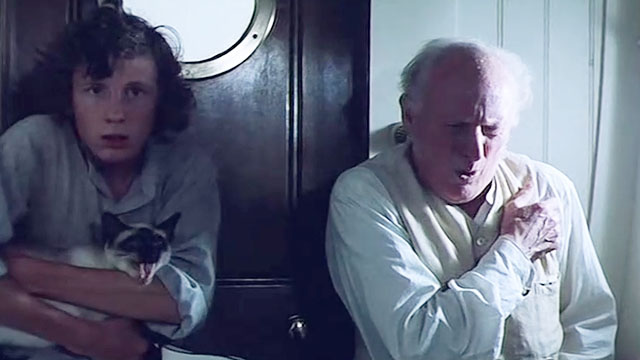 Warlords of Atlantis - Sandy Ashley Knight with yowling Siamese cat in his arms and Professor Aitken Donald Bisset