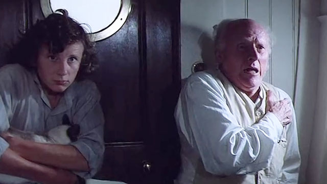 Warlords of Atlantis - Sandy Ashley Knight with Siamese cat hiding face in crook of his arm and Professor Aitken Donald Bisset