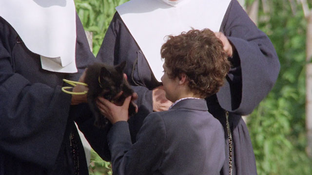 The Weapon, the Hour, the Motive - L'arma l'ora il movente - nuns handing black kitten to Ferruccio Arturo Trina