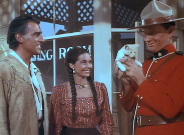 The Wild North - Jules Vincent Stewart Granger and Indian girl Cyd Charisse gives yellow tabby kitten to Mountie Pedley Wendell Corey