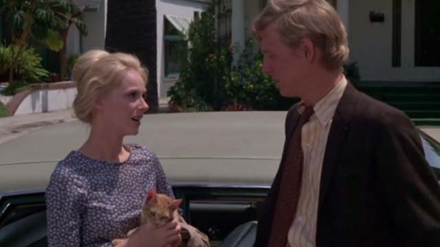 Willard - Joan Sandra Locke holding orange tabby cat Chloe with Willard Bruce Davison