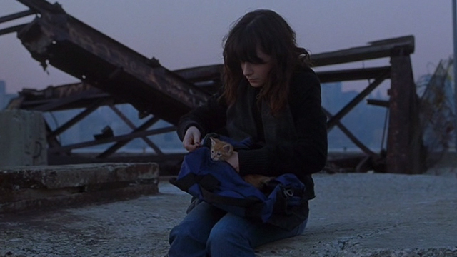 Winter Passing - Reese Zooey Deschanel by river with orange tabby kitten Spike in duffel bag